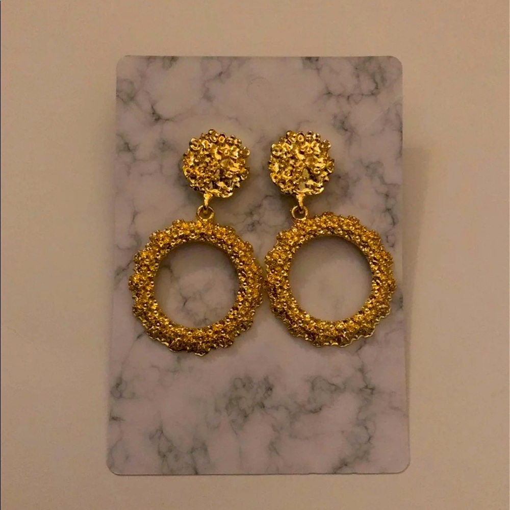 Gold colored earrings
